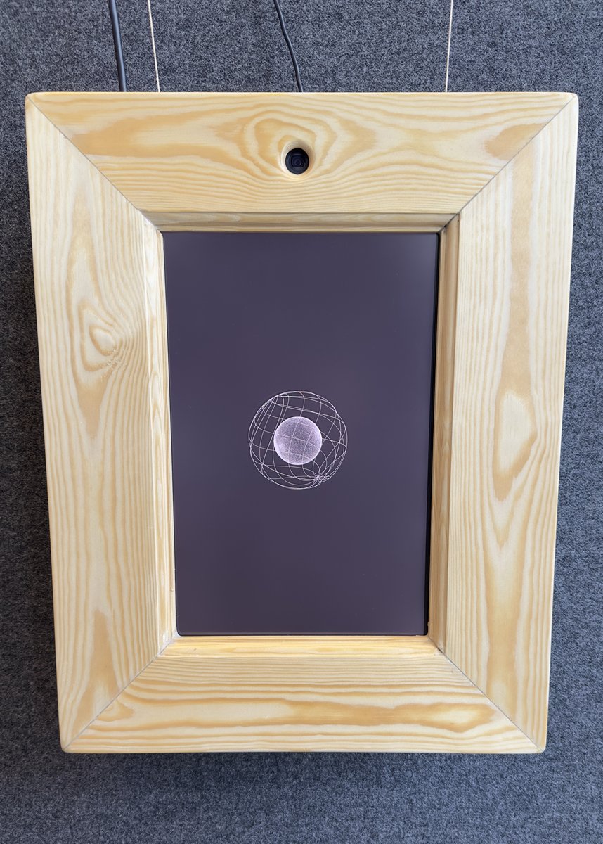 The Magic Mirror prototype head-on, showing the sphere visualization on screen